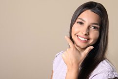 Woman smiling after receiving whitening treatment