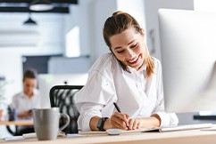 Woman smiling while working in office