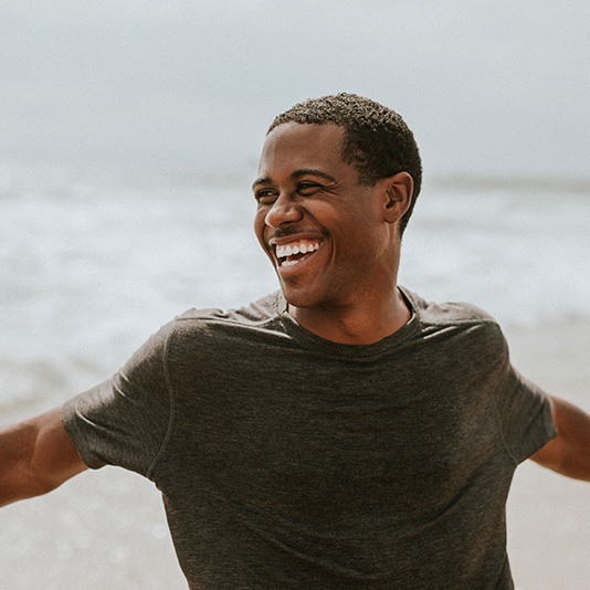 Smiling man at beach 